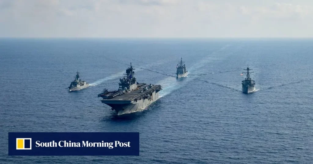 Navios militares em formação no oceano, representando diálogos sobre segurança marítima entre EUA e China.