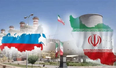 Planta nuclear com bandeiras do Irã e da Rússia, ilustrando cooperação energética entre os países. (Foto: tehrantimes.com)